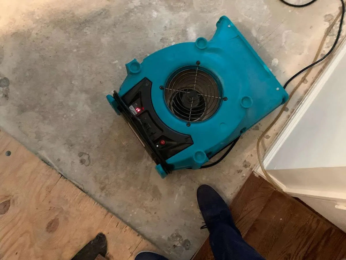 Air mover drying subfloor during Leak Detection & Repair in Lompoc